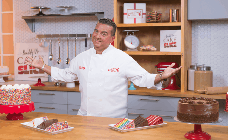 The Cake Boss behind a kitchen counter